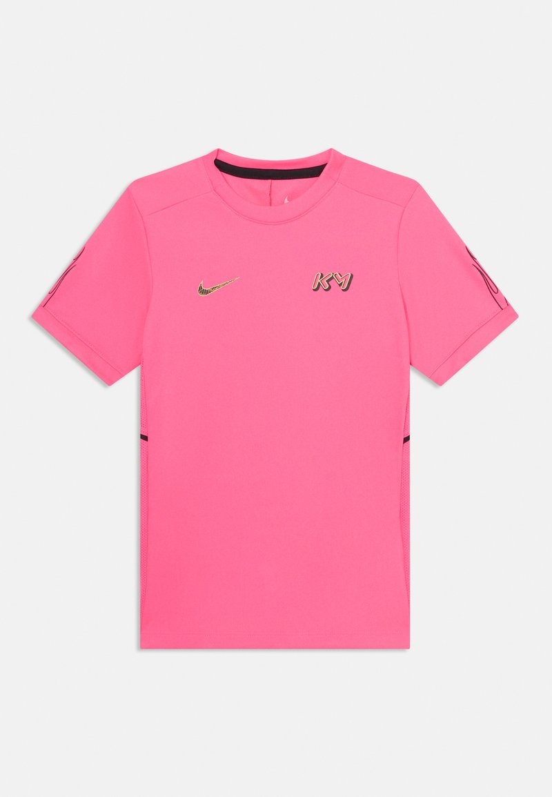 Lys rosa kortermet treningsskjorte med rund hals, svarte sideaksenter og gull Nike-logo samt KVM-tekst på brystet.
