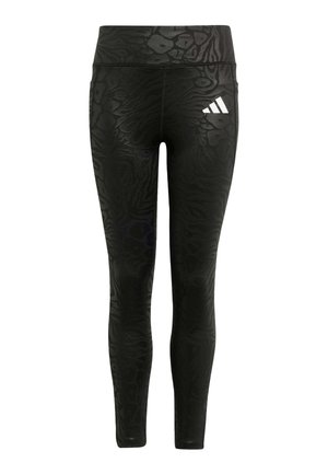 Črne legice z strukturiranim živalskim vzorcem, visokim pasom in belim adidasovim logotipom na levem bok. Gladek, raztegljiv material.