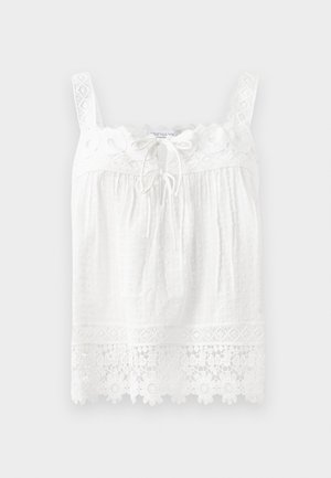 White sleeveless top made of textured fabric. Features a lace trim at the neckline and hem, with floral embroidery and a drawstring front.