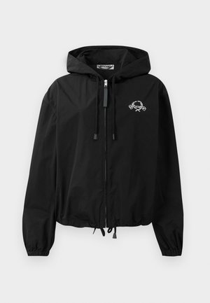 Black windbreaker jacket with a drawstring hood, elastic cuffs, and a zip closure. Features a white graphic logo on the chest. Lightweight material.
