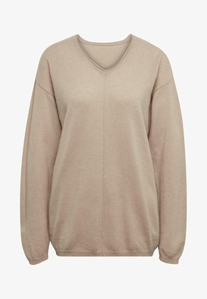 Beige V-hals trui gemaakt van zacht, gestructureerd materiaal met ovale schouders en geribbelde manchetten, met een centrale naaddetail.