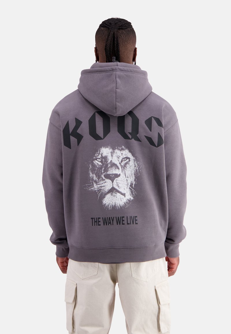 Gray hoodie with a lion graphic and black text “KOQS THE WAY WE LIVE” on the back. Features a hood and ribbed cuffs.