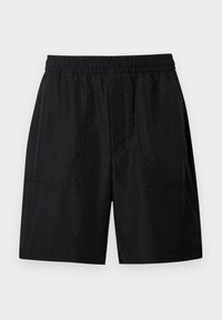 Shorts taille élastique noire avec deux poches plaquées à l'avant et une coupe droite arrivant au genou, sur un fond uni.