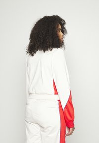 adidas Originals TRACK - Bluză de trening - white/vivid red