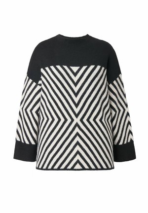 Sort og hvid strikketrøje med en chevron mønster, med en solid sort sektion på skuldrene og lange ærmer.