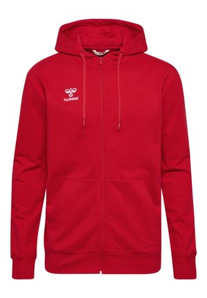 Sweat à capuche rouge zippé intégralement avec cordons, poches avant, poignets côtelés et petit logo blanc hummel sur la poitrine.