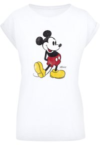 Valkoinen puuvillateeppari, jossa on vintage Mickey Mouse -grafiikka mustana, punaisena ja keltaisena. Pyöreä kaula-aukko ja lyhyet hihat.