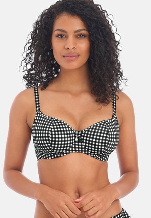 Soutien-gorge rembourré à imprimé vichy noir et blanc avec bretelles ajustables, soutien avec armature et un nœud décoratif au centre. Texture lisse.