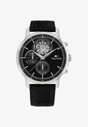 Black chronograph watch with stainless steel case, textured black leather strap, white hour markers, and multi-function subdials.