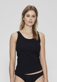 Black tank top made of smooth fabric, features a classic scoop neck and slim straps, with a fitted silhouette. Paired with matching bottoms.