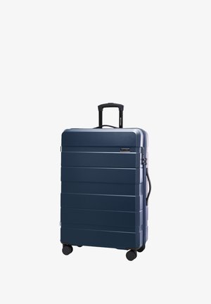 Harde koffer in marineblauw met horizontale groeven, uitschuifbare handgreep, twee wielen en een zijhandgreep voor gemakkelijke manoeuvrability.