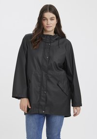 Black waterproof jacket with a hood, snap buttons, and two side pockets. Features a relaxed fit and a smooth, textured surface.