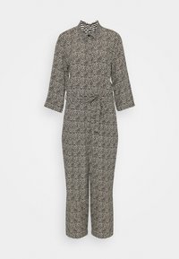 Combinaison noire et blanche avec un col montant, des manches trois-quarts, une taille ceinturée et des jambes raccourcies. Motif texturé sur le tissu.