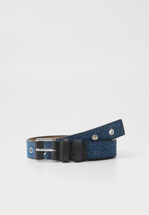 Denim belt in dark blue with black leather accents, featuring a metal buckle and silver hardware, includes multiple adjustment holes.