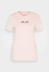 Jasnoróżowa koszulka z krótkim rękawem i okrągłym dekoltem z haftowanym na piersi logo "ARMANI EXCHANGE" w kolorze czerwonym i czarnym.