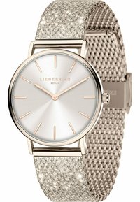 Runde silberne Uhr mit einem strukturierten, hellgrauen Netzarmband. Das Zifferblatt hat ein Sonnenstrahlenmuster und roségoldfarbene Akzente für die Stundenmarker und Zeiger.