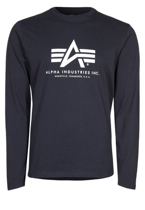 Granatowa koszula z długim rękawem z białym logo Alpha Industries Inc. i tekstem "Knoxville, Tennessee, U.S.A." wyśrodkowanym z przodu.