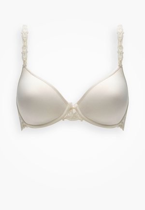 Creme Push-Up-BH mit glatten Cups, Spitzenakzenten an den Seiten und dekorativen Trägern. Hat ein Schmuckdetail in der Mitte vorne.