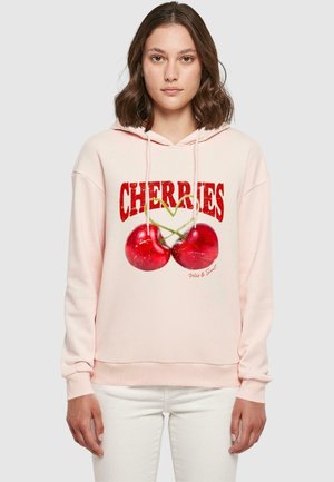 Helles rosa Hoodie mit einem vorderen Grafikdruck von zwei Kirschen und dem Wort "CHERRIES" in fettem Rot. Mit Kapuze mit Kordelzug und gerippten Manschetten.