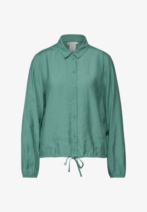 Jasnozielona bluzka z długim rękawem i kołnierzykiem, zapinana na guziki, z ściąganym dołem. Wykonana z gładkiego materiału o subtelnym połysku.