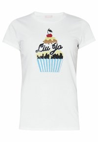 Camiseta de algodón blanca con un gráfico de cupcake adornado con lentejuelas en dorado, negro y azul. Mangas cortas y escote redondo.