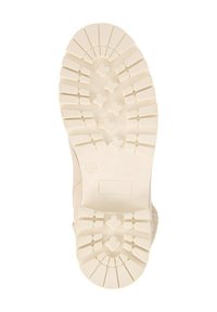 Sole di stivale in gomma beige con un motivo di battistrada testurizzato, caratterizzato da ampie scanalature e grip a forma di croce per una migliore aderenza. Taglia contrassegnata come 36.