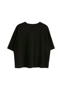 Svart oversized t-shirt i mjuk bomull, med korta ärmar, rund halsringning och en ren, sömlös baksidedesign.