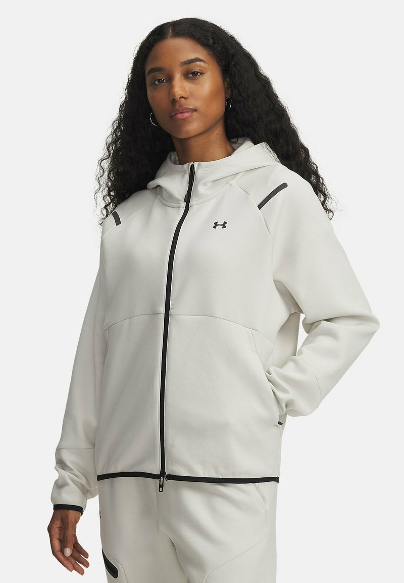 Hvid lynlås hoodie lavet af blødt stof, med hætte, sorte detaljer på skuldrene og frontlommer. Glat tekstur og afslappet pasform.