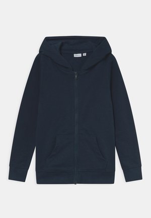 Hoodie zippé bleu marine en tissu doux, avec capuche à cordon de serrage, poches kangourou et poignets et ourlet côtelés.