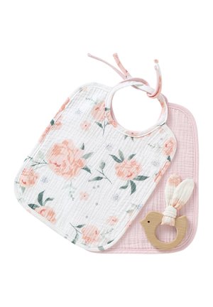 Quilted floral baby bib in white and pink, featuring pastel flowers and a rounded neck. Includes a wooden bird teether with fabric ears.