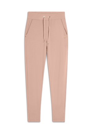 Pantalons de jogging rose clair avec une taille à cordon, deux poches latérales et un petit logo sur la cuisse gauche. Texture de tissu en coton doux.
