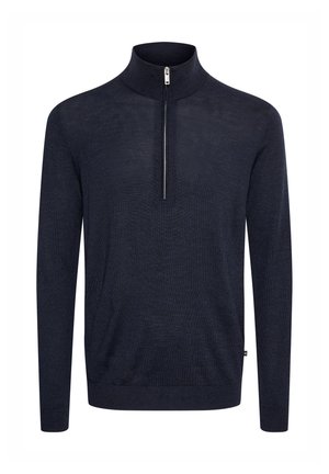Maglione blu navy con colletto alto e collo con zip. Realizzato in tessuto testurizzato, presenta maniche lunghe e una vestibilità standard.