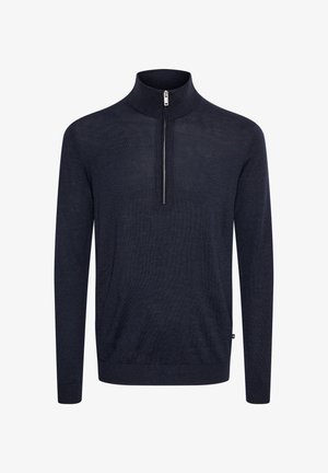 Pulover v mornarsko modri barvi s visokim ovratnikom in zadrgo. Narejen iz strukturirane tkanine, ima dolge rokave in standardno prileganje.