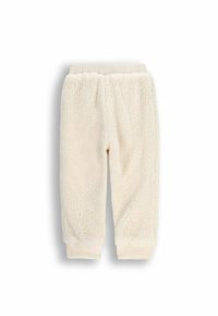 Kremowe dresowe spodnie z miękkiego polaru z elastycznym paskiem w talii i ściągaczami na nogawkach. Miękka tekstura o puszystym, przytulnym wyglądzie.