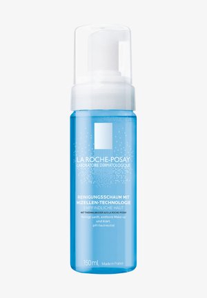 Foaming cleanser in a transparent blue bottle with a white pump. Features simple branding and text, with a volume of 150ml.