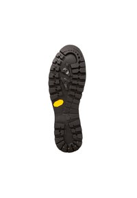 Semelle extérieure en caoutchouc Vibram avec des crampons profonds pour une traction, arborant un logo hexagonal jaune. Principalement noir avec une texture robuste.