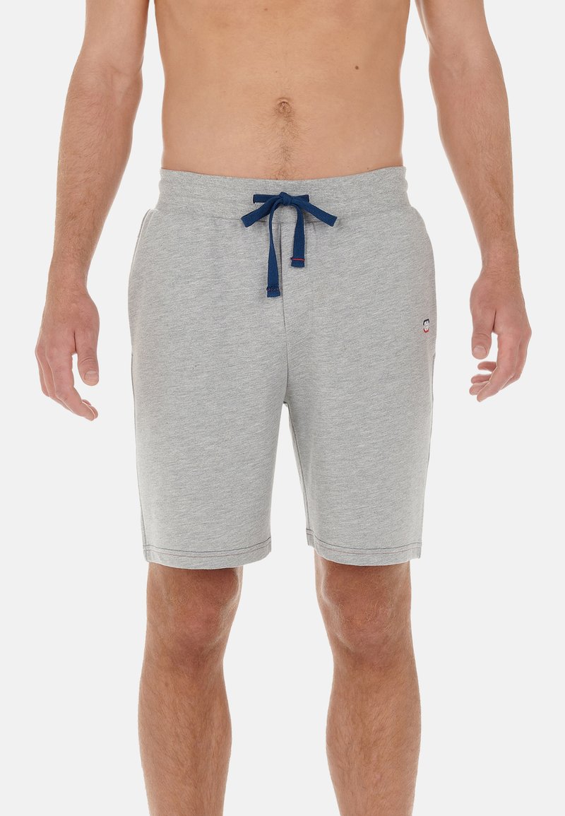 Šedé šortky z bavlněné směsi s elastickým pasem v námořnické modři, obsahující boční kapsy a malé logo na levé noze. Hladká textura.