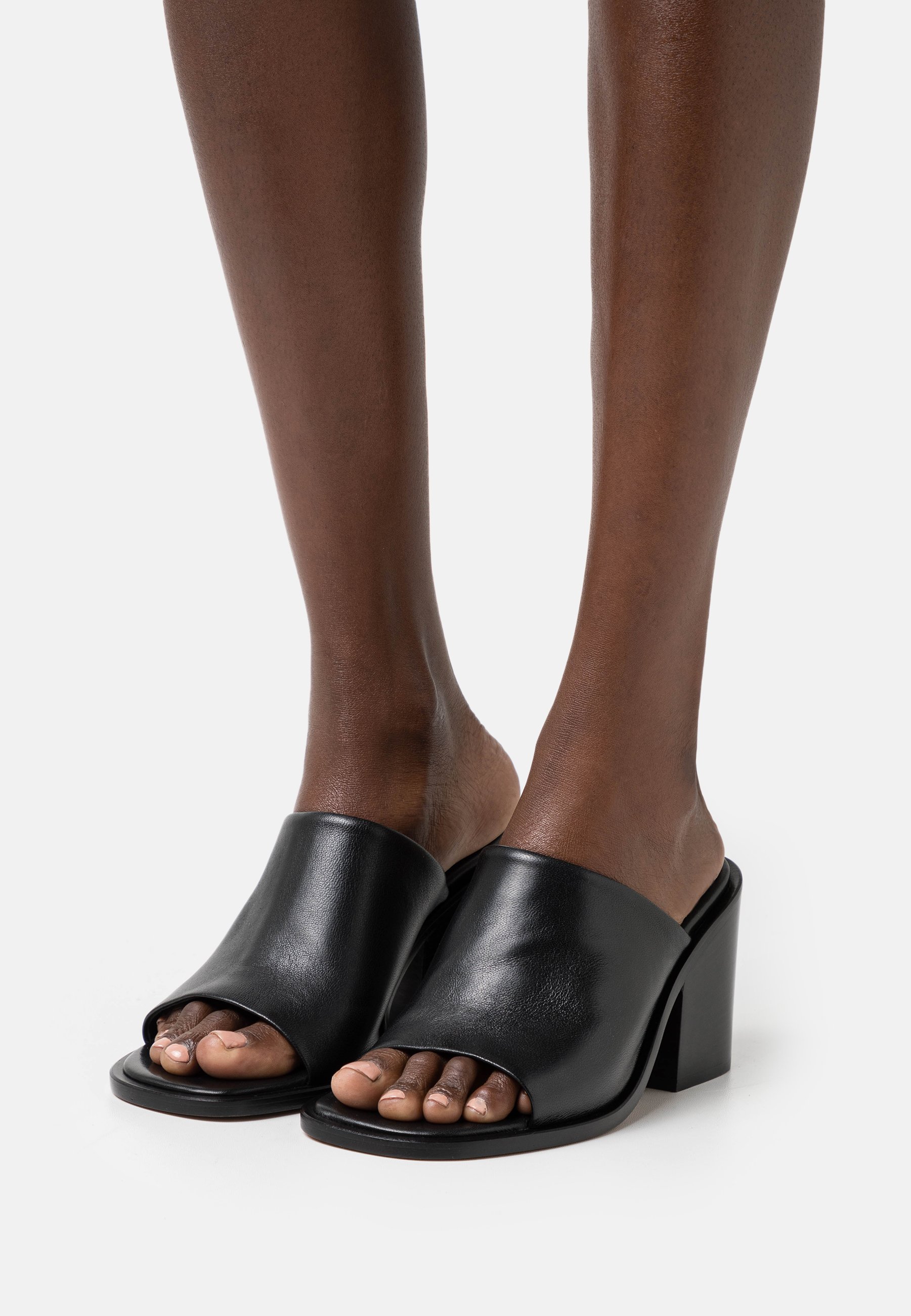 black leather slip on mules