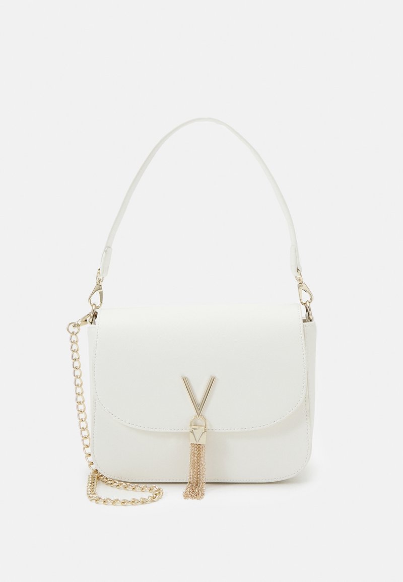 White faux leather handbag with gold-tone hardware, V-shaped clasp, chain and shoulder strap, and tassel detail at the front.