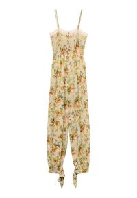 Floral jumpsuit with thin straps, light beige background, orange and green floral pattern, gathered waist, and tie cuffs at the ankles.