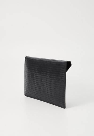 Black clutch bag made of faux crocodile leather. Rectangular shape with a smooth texture and a folded flap design. Simple, modern appearance.