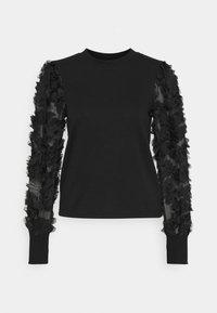 Camisa negra de manga larga con cuerpo ajustado. Las mangas presentan un detalle de volantes en capas en tela transparente, creando una apariencia texturizada.