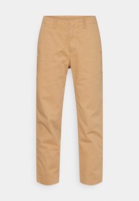 Chinos beiges en coton, avec une coupe droite, des passants de ceinture, une fermeture éclair et des poches avant. Texture lisse sans motifs.