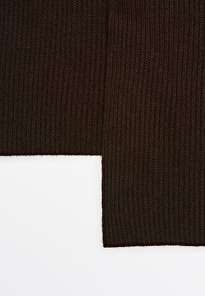 Brun ribbad tyg med en texturerad yta, med två kanter som möts i en rät vinkel, vilket skapar en lagerlook.