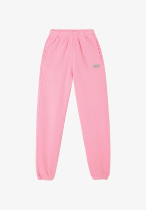 Rozā sporta bikses, kas izgatavotas no mīkstas auduma, ar elastīgu jostasvietu, sānu kabatām un mazu "American Vintage" logo zaļā krāsā.