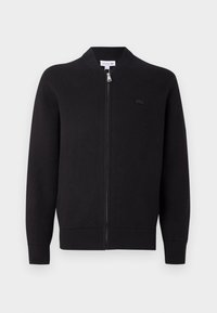 Cardigan zippé noir avec col, poignets et ourlet côtelés, présentant un petit logo brodé sur la poitrine gauche.