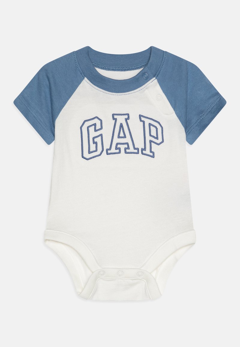 Short-sleeve baby bodysuit with blue raglan sleeves, cream body, snap closures, and "GAP" logo in blue embroidery on the front.
