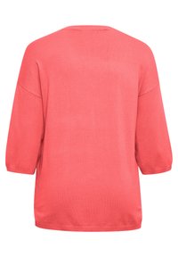 Korallfärgad tröja med trekvartsärmar och avslappnad passform. Mjuk, texturerad stickad tyga med rundad halsringning och utan mönster.