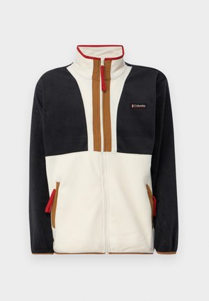 Fliisjakker, millel on kõrge krae, tõmblukk ja värvilise plokiga disain, kus on sinine, kreemja ja pruuni sektsioonid. Punased tõmbluku aktsendid.