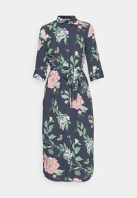 Blomstermaxikjol i marinblått tyg med trekvartslånga ärmar, knapplist framtill och knytning i midjan. Har stora rosa och gröna blommönster.